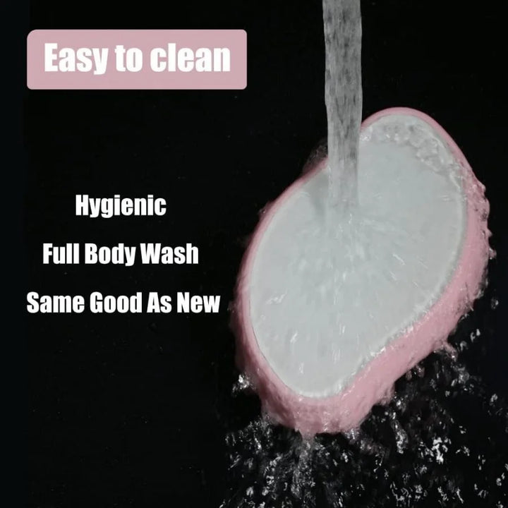 Waterproof black facial massager being washed under running water, showcasing easy-to-clean hygienic design