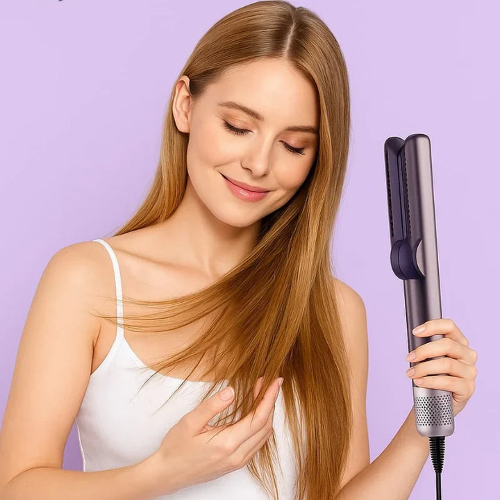 Smiling woman with long blonde hair using AeroPress Glide in blow dry mode, showing airflow styling on straight hair with purple background